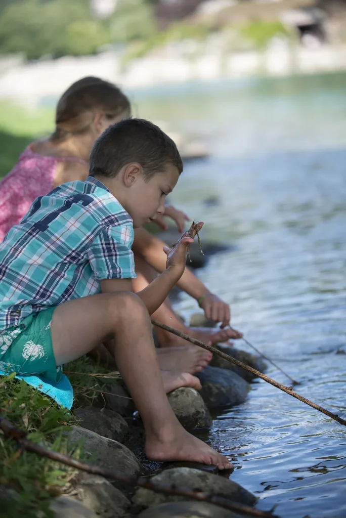 Children on the banks of Lake Ferréols in Digne les Bains