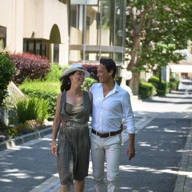 Loving couple in front of the thermal baths of Digne les Bains